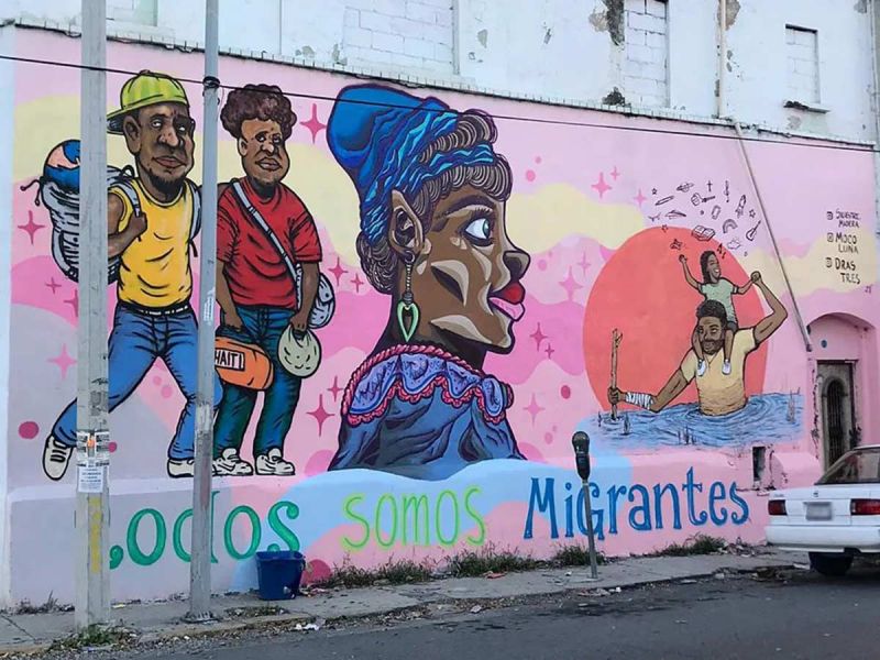 Homenajean a migrantes haitianos con mural en calles de Nuevo León